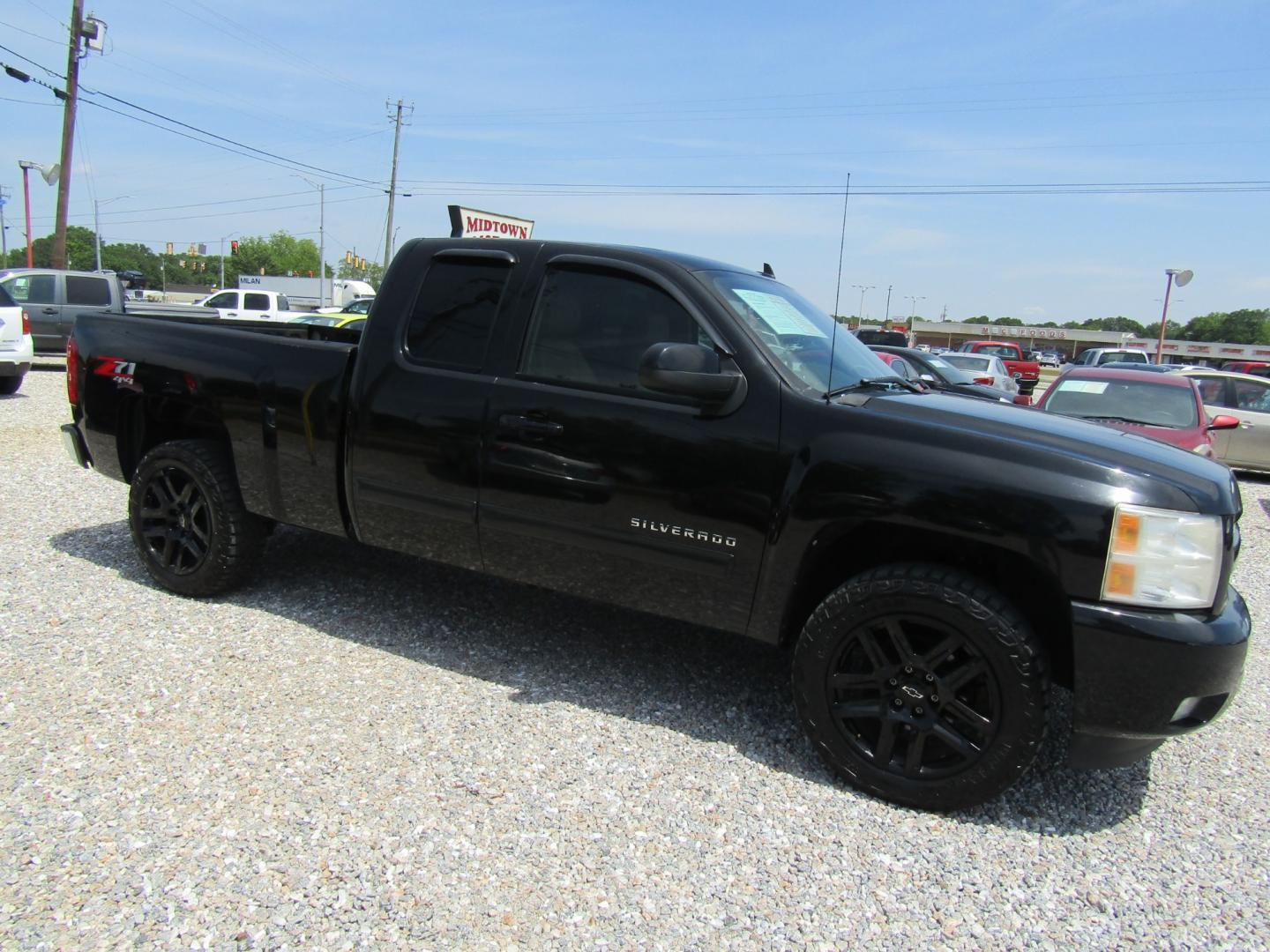 2011 Black /Tan Chevrolet Silverado 1500 LT Ext. Cab 4WD (1GCRKSE35BZ) with an 5.3L V8 OHV 16V FFV engine, Automatic transmission, located at 15016 S Hwy 231, Midland City, AL, 36350, (334) 983-3001, 31.306210, -85.495277 - Photo#0